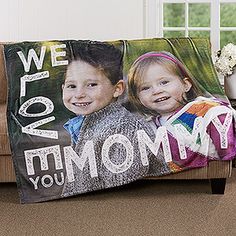 a blanket that says, we love you mom and two children on it with an image of the same person