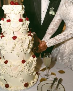 a newly married couple cutting their wedding cake