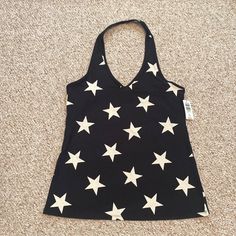 Super Cute Black And White Stars Halter Tank Top. Size 2. Made From Cotton And Spandex. Maximum Stretch Level And Doesn’t Ride Up. Perfect For Date Night Or A Summer Fit. Pair With Jean Shorts Or Dark Denim. Casual Stretch Top With Star Print, Black Stretch Top With Star Print, Fitted Sleeveless Top With Star Print, Casual Star Print V-neck Top, Black And White Stars, Cute Black And White, Halter Tank Top, Halter Tank, White Stars