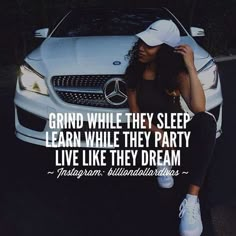 a woman sitting in front of a white car with the words grind while they sleep learn while they party live like they dream