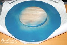 a blue plate sitting on top of a wooden table