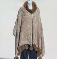 Unique One-Of-A-Kind Himalayan Yak/Sheep Wool Blend & Fox Fur Cape/Shawl/Wrap !!!…Ideal Unique Handcrafted gift for you, family, your friends and co-workers…!!! Handloomed/Handcrafted by Artisans Hand Embroidery Stitched Accents that Emphasize the Patterns in the Shawl Design,  Boiled Himalayan Yak/Sheep Wool Blend Shawl Handmade in Nepal Fox Fur Collar Fox Fur Tassels or Fringe at Both Ends Tribal Design and Pattern A Yak & Sheep Wool Blend of yarns hand loomed shawl in Nepal is handcrafted by Shawl Design, Cape Shawl, Fur Cape, Spring Wear, Boiled Wool, Hand Embroidery Stitches, Shawl Wrap, Hand Crafted Gifts, Sheep Wool