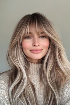 7. Champagne Blonde with Long Feathered Layers (Long Layered Hair With Bangs) - Long Layered Hair With Bangs Elle Bangs Hair, Long Fringe Long Hair, 70s Long Hair With Bangs, Long Hair Feathered Bangs, Root Smudge With Bangs, Light Blonde With Bangs, Ash Blonde Curtain Bangs, Medium Blonde With Bangs, Dark Blonde Balayage With Bangs