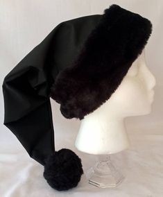 Please read to the very end for shop language and product description Unquestionably one of our most unusual and most popular hats. This solid black Christmas hat is made from black breathable cotton, lined with cotton, and features our exclusive black fur brim/flocking and pom pom, this hat is certainly a conversation piece. It is certainly a rarity to see a solid black Christmas hat, surely everyone will want to know where you got it from. (The Black Brim/flocking and pom pom can be substitute Black Beanie Costume Hat For Winter, Black Beanie For Winter - Costume Hat, Black Cap For Winter Costume, Merry Gothmas, Black Christmas Tree Decorations, Santa Hat Png, Black Christmas Decorations, Winter Angel, Goth Christmas