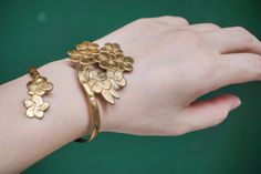 Here is a dainty Peach Blossom brass bracelet with a art nouveau taste turned in a boho chic jewel. These rings and bracelet are gold-colored, but simple trinkets are still a hinkcker. The brass is bendable, please bend the product along your finger to adjust the ring, bracelet to be fit to your hand! ►Handcrafted from 100% pure brass by Vietnam skilled craftsman. It is soldered together using hand-engraved, hammered, textured and gently polished. Due to the simplicity, these bracelets are perfe Honey Bracelet Plant, Unique Brass Wedding Bracelets, Unique Brass Bracelets For Wedding, Bronze Brass Flower-shaped Jewelry, Vintage Brass Flower Jewelry, Flower-shaped Bronze Brass Jewelry, Bronze Brass Flower Jewelry, Art Nouveau Bracelet Jewelry Gift, Brass Hair Pin