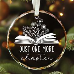 a glass ornament with the words just one more charter written in white on it