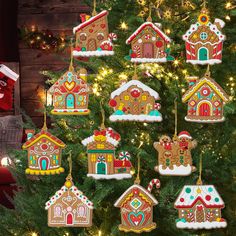 a christmas tree decorated with gingerbread houses