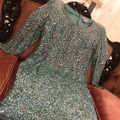 Need A Great Holiday Dress! This One Sparkles Like Blue Ice And Will Give Them Something To Talk About! This Aqua And Silver Sequined Dress Is Selfieready And A Conversation Starter. The Pics Tell The Story! Bust - Pit To Pit 20 (40 Inches) Waist - 36 1/2” Hips - 44” Length - 40” Festive Fitted Evening Mini Dress, Festive Fitted Mini Evening Dress, Fitted Festive Mini Dress For Evening, Fitted Mini Dress For Festive Evenings, Formal Fitted Sparkling Mini Dress, Festive Fitted Sparkling Dresses, Festive Fitted Embellished Dress, Festive Embellished Fitted Dresses, Sparkling Fitted Mini Dress For Evening