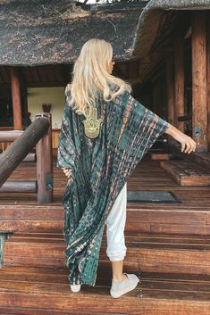 Zambia Hamsa Kimono. The perfect kimono for festivals, rave parties, and all events in Ibiza, Mykonos, and Tulum. This kimono is one size fits all, suitable for both men and women of all sizes. It features pockets on each side. • Model in the picture is 160cm tall• Material: Cotton• Pockets on the sides• Dark green color• Approximately 120cm long Kimono For Men, Beach Clubs, Rave Party, Batik Pattern, Kimono Pattern, Long Kimono, Green Colour, Rave Outfits, Zambia