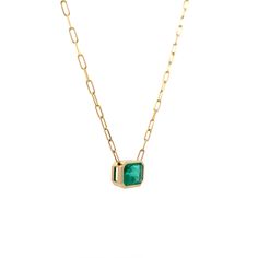 This pendant necklace features a 4.12-carat emerald cut emerald set in an east/west orientation. The vibrant green emerald is bezel set in polished 14 karat yellow gold, creating a sleek and elegant look. The pendant is paired with a paperclip chain, adding a modern touch to the classic gemstone. Whether worn alone or layered, this necklace adds a bold splash of color and style to any outfit Engagement Ring Style Guide, Ring Style Guide, Emerald Set, Platinum Rose Gold, Sapphire Solitaire, Engagement Ring Styles, Shop Engagement Rings, Green Emerald, Vibrant Green