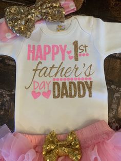 "Newborn and Infant/Toddler Fathers Day Outfit! This white bodysuit is adorned with \"Happy 1st Fathers Day Daddy\" in pink and gold glitter vinyl (professionally head pressed), a matching gold/pink glitter bow headband, pink bloomers with a sequin gold bow, and matching pink legwarmers accented with a gold vinyl heart.. Visit more fathers day outfits and holidays here: https://www.etsy.com/shop/PrincessKeepsakes/edit?ref=edit_trust_header&section_id=21438616 We can Custom Personalized this Personalized Pink Onesie For Birthday, Personalized Pink Onesie For First Birthday, Pink Onesie With Letter Print For First Birthday, Pink Letter Print Onesie For Gender Reveal, Pink Cotton Bodysuit As Gift, Fitted Bodysuit For Birthday And Mother's Day, Cute Pink Onesie For Mother's Day, Pink Onesie With Letter Print As A Gift, Pink Onesie With Letter Print As Gift