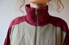 "Bordo workout jacket, vintage bomber, tracksuit, outdoor jacket, 90s activewear, men running jacket, women windbreaker, sports jacket, M/L Vintage bordo workout jacket with gray color block. Jacket has two side pockets and nice high collar to protect you from wind and make you feel cosy! Size: given GB 16, seems like women (L) and men (M) PLEASE CHECK ALL MEASUREMENTS BELLOW: Length: 63 cm/ 25\" Shoulder to shoulder: 64 cm/ 25\" Sleeves: 50 cm/ 20'' Chest: 122 cm/ 48\" Condition: excellent Fabr Outdoor Cotton Track Jacket Hoodie, Outdoor Cotton Hoodie Track Jacket, Sporty Tracksuit For Outdoor Fall Activities, Fall Sportswear Tracksuit For Outdoor, Fall Outdoor Sportswear Tracksuit, Cotton Sportswear Track Jacket With Pockets, Oversized Functional Long Sleeve Track Jacket, Oversized Long Sleeve Functional Track Jacket, Sporty Fitted Windbreaker With Pockets