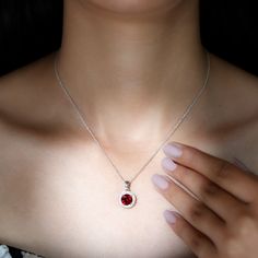 Product Details Indulge in a moment shell cherish forever by treating her to a romantic dinner and gifting her with a timeless Classic Pendant Necklace. This sophisticated accessory features an exquisite 8 MM round-cut Lab Created Ruby set in a secure prong setting and surrounded by a brilliant halo of Zircon stones. Crafted in lustrous gold metal, this red gemstone pendant necklace will undoubtedly make her stand out in any crowd. Product Information SKU SHP-PENDANT012148428 Length 18.6 mm Widt Classic Pendant Necklace, Ruby Set, Ruby Necklace Pendant, Halo Necklace, Gemstone Pendant Necklace, Ruby Pendant, Halo Pendant, Romantic Dinner, Ruby Necklace