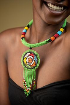 Unique African Maasai Handcrafted Beaded Necklace with an Elegant Look and Brilliant Finish. **GET FREE SHIPPING FOR ADDITIONAL ITEMS PURCHASED. Yes, Buy Multiple Items and pay shipping for 1 item only- The rest ships Free. (No Limits on the number of Multiple items). With a faster delivery time of 3 days via DHLExpress, Worldwide. Ordinary/Standard Shipping also available upon request. We Custom Make to Suit Your Taste. Available In All Colors and Sizes. For wholesale please chat me up for disc Traditional Green Beaded Necklace For Festival, Green Bohemian Necklace With Dangling Beads, Traditional Green Beads For Festival, Green Bohemian Choker For Festivals, Bohemian Round Beaded Chain, Traditional Green Beaded Necklaces With Dangling Beads, Traditional Green Beaded Necklace With Dangling Beads, Bohemian Beaded Round Choker, Bohemian Green Beaded Necklace With Beaded Chain