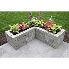 a stone planter with flowers in it