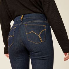 This dark-wash jean has so many striking details—from the pintuck on the front (so flattering!) and the minimal welt pockets, all the way down to the exaggerated trouser hem. Elevated and chic, it adds polish to office outfits and party looks alike. Contoured waistband hugs your curves for a fit that moves with you Slim through hip and thigh Perfect rise sits just below the waist 9" front rise Gradually widens from the knee to 21 ½" wide leg opening Inseam measurements - Short (S): 31", Regular Denim Details Jeans, Nfr Style, Authentic Turquoise Jewelry, Slim Trousers, Cowboy Boots Women, Dark Wash Jeans, Top Graphic Tees, Kids Boots, Party Looks