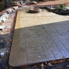 an outdoor patio with stone steps and seating area