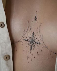 a woman's stomach with an intricate design on it