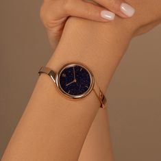 Claire's unique ring-like shape and hidden crown make it look more like a bracelet than a watch. The genuine blue sandstone dial pairs beautifully with the polished rose gold bangle. Material: Stainless Steel Finishing: 23k Gold Plating Dial: Genuine Sandstone Movement: Swiss Ronda Quartz Glass: Hardened Mineral Crystal Water Resistance: 3 ATM Gold Bangle Watch, Unique Watches Women, Unique Watches, Rose Gold Watches Women, Vintage Watches Women, Blue Sandstone, Gold Watches Women, Rose Gold Bangle, Bracelet Watches Women