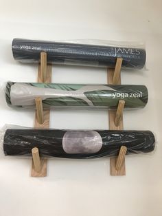 three different types of umbrellas on wooden sticks