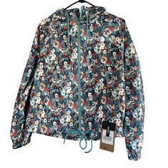 Brand New North Face Antora Rain Jacket Reef Water Wild Daisy Print Womens Size - Small The North Face Spring Outdoor Outerwear, Blue Casual Floral Print Outerwear, Casual Blue Floral Print Outerwear, Spring Blue The North Face Outerwear, Blue The North Face Outerwear For Spring, The North Face Long Sleeve Windbreaker For Spring, Casual The North Face Windbreaker For Fall, The North Face Hooded Windbreaker For Spring, Casual Spring Outerwear By The North Face