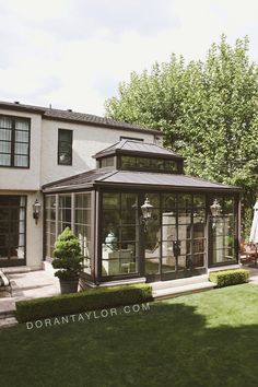 a house with a large glass enclosed patio