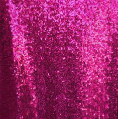 pink sequins are covering the surface of a window