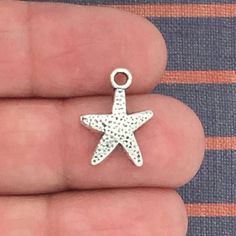 You will receive 20 - Starfish Charms in Antique Silver Pewter 16x12mm by TIJC! These charms are a quality Silver Pewter for all your jewelry and crafting projects! - (20) Silver Starfish Pendant - 16x12mm ( 25.4mm = 1 inch ) - Quality Pewter - Item # SP0083 All Items will come as shown in a poly bag! WE ARE LOCATED IN TEXAS. WHICH MEANS YOU RECEIVE ITEMS QUICKLY IF IN THE U.S! WE ALSO SHIP INTERNATIONALLY All items are shipped after payment is received for your convenience We order each charm a Sea Life Jewelry, Gold Rosary, Island Jewelry, Starfish Pendant, Dragonfly Charm, Monogram Ring, Star Fish, Jewellery Making Materials, Miraculous Medal