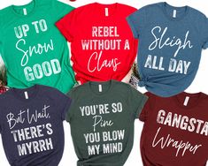 six t - shirts with sayings on them in different colors and styles, including red, green, blue, black, and white