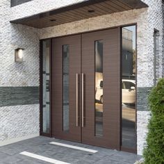 a modern entry with double doors and sidelights