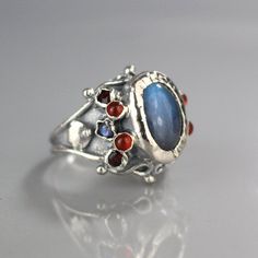 His and Hers Ring, Oval Cut Ring, Labradorite Silver Ring, Labradorite Garnet Carnelian Ring, Births Oval Multi-stone Moonstone Ring In Sterling Silver, Unique Oval Moonstone Ring With Bezel Setting, His And Hers Ring, Labradorite Ring Silver, His And Hers Rings, Oval Cut Ring, Real Queens, Carnelian Ring, Ring Bezel