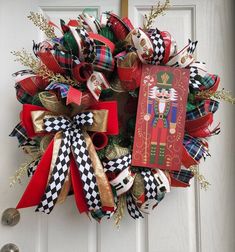 a christmas wreath on the front door with an image of a nutcracker and book