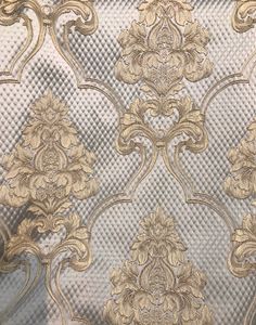 an ornate gold and silver wallpaper pattern