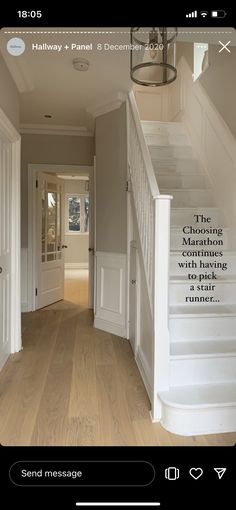 an image of a house with stairs in the hallway and texting on the wall