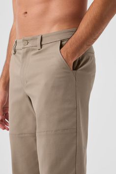 PSA: Alo makes more than performance pants. Like this easygoing cotton twill pair: They’re a touch structured, a touch stretchy, and look put together without much effort. They have classic design details (belt loops, pockets and slightly tapered legs) plus seamed panels on the legs for a fresh finish. All you have to do? Pick your favorite color and pair them with a plain tee. Alo Yoga 4-way Stretch Elastane Bottoms, Alo Yoga Solid Color Pants With Pockets, Alo Yoga Solid Pants With Pockets, Versatile Alo Yoga Bottoms, Versatile Solid Color Alo Yoga Bottoms, Casual Alo Yoga Straight Pants, Casual Alo Yoga Pants For Work, Stretch Cotton Cargo Pants With Belt Loops, Alo Yoga Elastane 4-way Stretch Bottoms