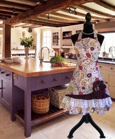 a dress is displayed on a mannequin in front of a kitchen island and sink