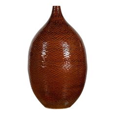 a large brown vase sitting on top of a table