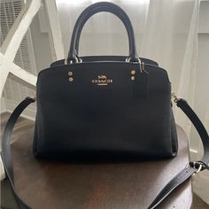 Used A Few Times. Looks Brand New. Luxury Black Satchel With Removable Pouch, Designer Black Satchel With Detachable Handle, Designer Black Satchel Tote, Black Top Handle Satchel With Gold-tone Hardware, Designer Black Satchel With Double Handle, Elegant Black Bag With Removable Pouch, Elegant Black Satchel For Everyday Use, Coach Black Satchel With Handle Drop, Black Crossbody Satchel With Handle Drop