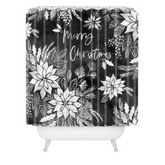 a black and white shower curtain with flowers on it that says merry christmas in the center