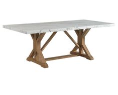 a white marble top dining table with wooden legs and an x - leg base in the center