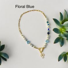 Spring and summer floral necklaces. Available in different colors of flowers, yellow, blue, orange, green, purple. Pls select price remains the same.  These are fun, colorful spring and summer floral necklaces! Made with genuine pearls, floral beads, semi precious stones and gold filled ball bead spacers, chain is gold stainless steel, anti tarnish. The toggle lock with floral shell charm is gold filled. Note: no two necklaces will be exactly the same. Design will slightly vary depending on colo Blue Beaded Necklace With Pearl Charm For Beach, Blue Beaded Necklaces With Pearl Chain, Blue Beaded Necklaces With Pearl Detail For Gifts, Blue Beaded Necklaces With Pearl Chain For Gift, Blue Pearl Chain Beaded Necklaces As Gift, Floral Necklaces, Beaded Pearl Necklace, Colorful Statement Necklace, Orange Green Purple