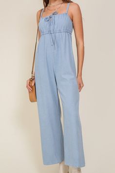 THE PERFECT MIX OF FLIRTY AND FUN, THIS JUMPSUIT IS READY FOR ANY SUMMER OCCASIONS. THE FLOWY SILHOUETTE IS COMPLEMENTED BY A SQUARE NECK LINE, RUCHED BUST, AND FRONT KEYHOLE DETAILS. WHETHER YOU ARE SIPPING COCKTAILS OR DANCING THE NIGHT AWAY, THIS DENIM BLUE JUMPSUIT WILL HAVE YOU FEELING THE BEST.* SLEEVELESS DESIGN* SPAGHETTI STRAP* SELF FRONT TIE* FRONT KEY HOLE* LIGHTWEIGHT MATERIAL* THE MODEL IS 5'9" AND WEARING SIZE SMALLMade In: ChinaFabric Contents: 90% cotton 10% viscoseSize Measureme Jumpsuit Fitted, Blue Jumpsuit, Jumpsuit Summer, Blue Jumpsuits, Tie Sleeve, Sleeveless Jumpsuits, Denim Jumpsuit, Light Denim, Tie Neck