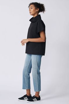 Our Ary Cuff Kimono Tee is the get up and go style of the season. This pull-on style, made in our Italian Broadcloth, makes a cool addition to any wardrobe. Pair with our Split Hem Capri or Angle Seam Jogger for the perfect uniform look. Pullover entry, easy fit, 2-ply collar and cuffs. - 51% Cotton, 49% Nylon- Fabric woven in Italy- Made in NYC - Dry clean or machine wash- Our model is 5'9" wearing size S- Chest 42", Bottom Opening 45", Length 25" Orders are processed within three business days Get Up And Go, Nylon Fabric, Split Hem, Collar And Cuff, Get Up, Black Tee, Woven Fabric, Dry Clean, Cuff