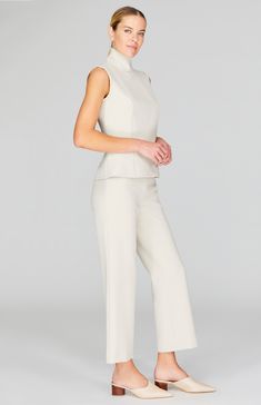 A classic straight leg pant with all the right details. Cut in a comfortable and luxurious Italian double face fabric, this ankle length pant has a beautiful drape and weight and is finished with a simple back zip to maintain a clean front. NOTE: This pant runs generously and most people have sized down from their typical Mi Jong Lee pant size. Elegant Bottoms With Straight Hem For Spring, Elegant Wide-leg Pants For Business Casual, Elegant Wide Leg Pants With Pressed Crease, Elegant Straight Workwear Pants, Elegant Straight Pants For Workwear, Elegant Straight Leg Dress Pants For Work, Elegant Wide Leg Pants For Work, Elegant Stretch Wide Leg Pants For Formal Occasions, Elegant Wide Leg Pantsuit