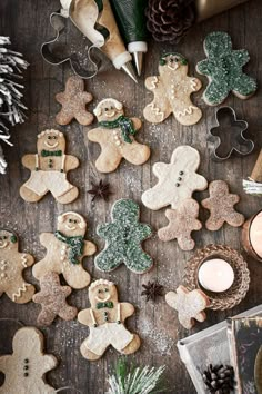 christmas cookies are arranged on a wooden table