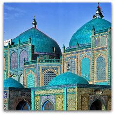 an elaborately decorated building with blue domes