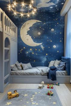 a child's bedroom decorated in blue with stars and the moon painted on the wall