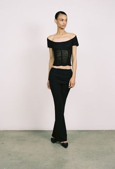 Introducing our Alana Pant in Jet Black. This mid-rise sheer pant flares slightly at the bottom and can be folded over along the waist as a styling detail. The perfect everyday pant.True to size, sculpting fabric.Please refer to the flat lay image for product accuracy. Elegant Black Pants With Flared Hem, Black Bottoms With Flared Hem For Evening, Elegant Black High-waisted Flare Pants, Elegant Black High-waisted Flares, Black Elegant Evening Flares, Elegant Black Flares For Night Out, Elegant Black Flares For Party, Elegant Black Flares For Evening, Elegant Black Evening Flares