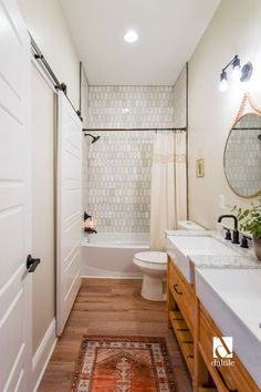 Scary to Chic in Old Southside | HGTV’s Good Bones Bathroom Remodel Mid Century, Warm Toned Bathroom, Daltile One Quartz, Modern Beach House Bathroom, Daltile Octagon And Dot Bathroom, Daltile 2x8 Vertical Tile, Inviting Bathroom, Daltile Mesmerize Bathroom