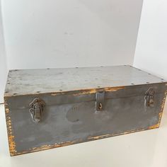 an old trunk is sitting on the floor